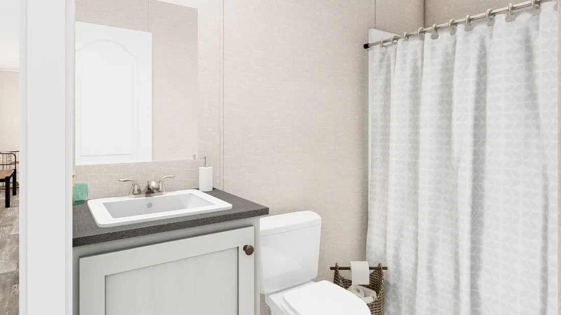 The THE ANNIVERSARY PLUS Guest Bathroom. This Manufactured Mobile Home features 3 bedrooms and 2 baths.