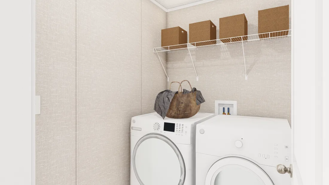 The THE ANNIVERSARY PLUS Utility Room. This Manufactured Mobile Home features 3 bedrooms and 2 baths.