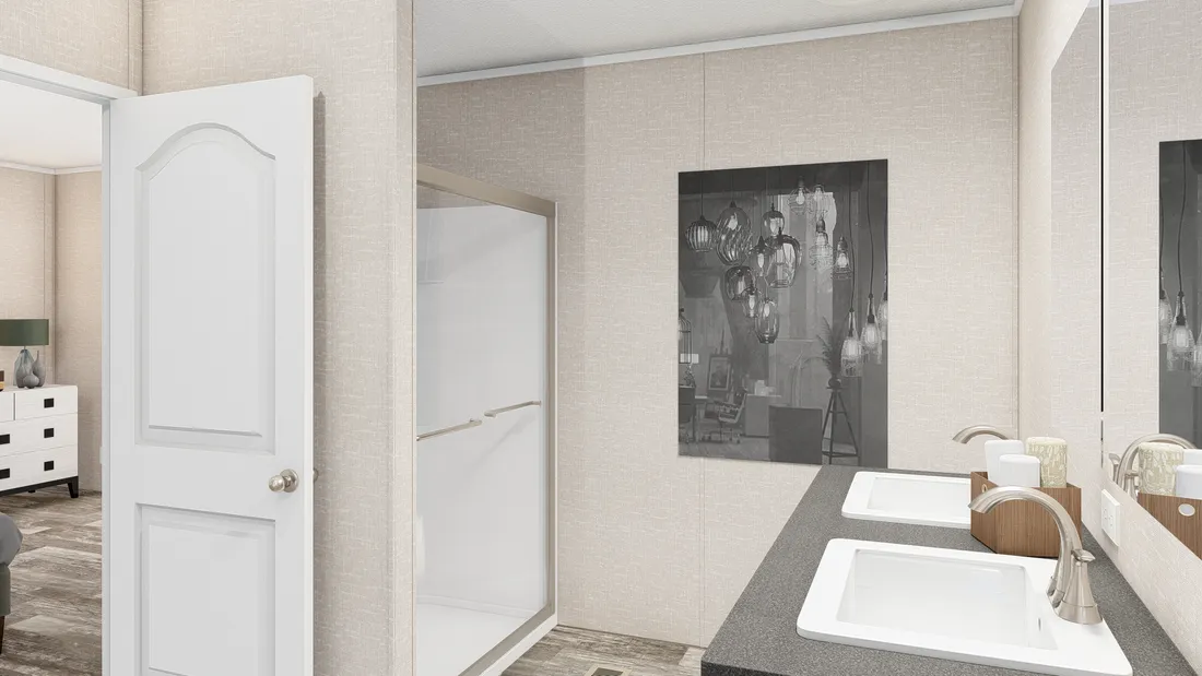 The THE ANNIVERSARY PLUS Primary Bathroom. This Manufactured Mobile Home features 3 bedrooms and 2 baths.
