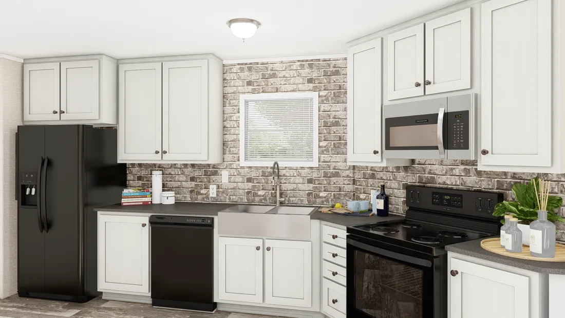 The THE ANNIVERSARY PLUS Kitchen. This Manufactured Mobile Home features 3 bedrooms and 2 baths.
