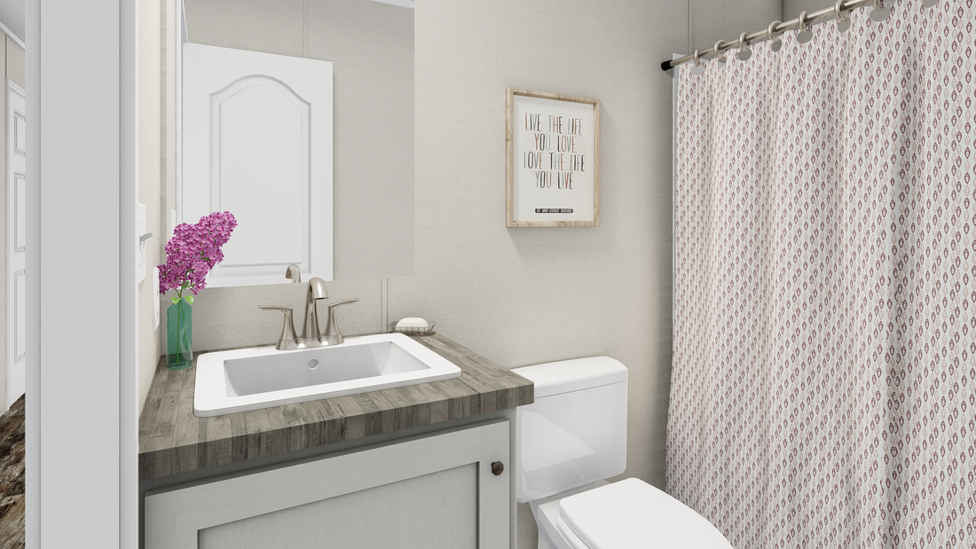 The ANNIVERSARY  EXCEL Guest Bathroom. This Manufactured Mobile Home features 3 bedrooms and 2 baths.