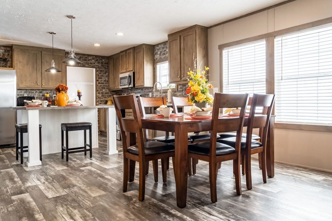 The ULTRA EXCEL 4 BR 28X60 Dining Area. This Manufactured Mobile Home features 4 bedrooms and 2 baths.