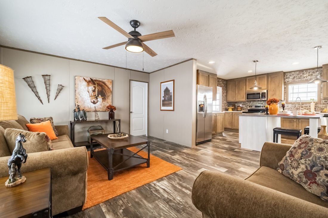 The ULTRA EXCEL 3 BR 28X60 Living Room. This Manufactured Mobile Home features 3 bedrooms and 2 baths.