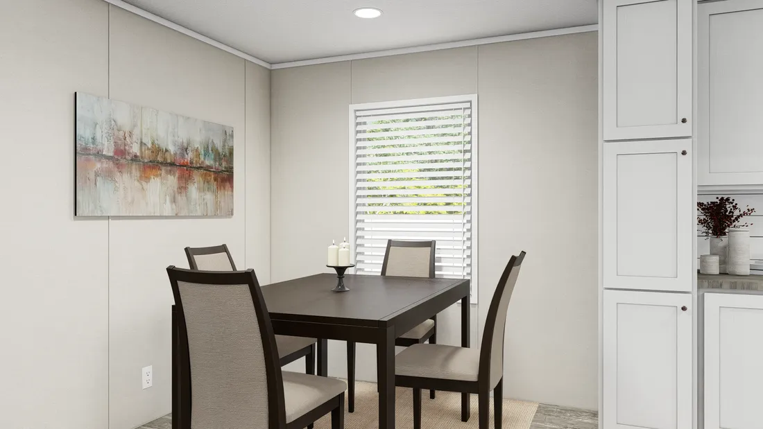 The ULTRA BREEZE 28X52 Dining Area. This Manufactured Mobile Home features 3 bedrooms and 2 baths.