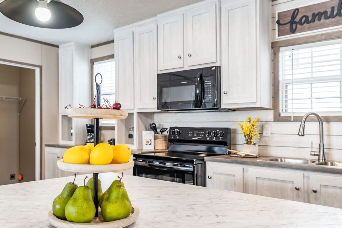 The ULTRA EXCEL 3 BR 28X56 Kitchen. This Manufactured Mobile Home features 3 bedrooms and 2 baths.