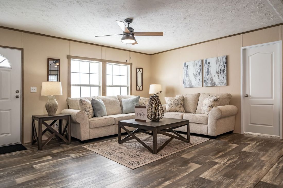The ULTRA EXCEL 3 BR 28X56 Living Room. This Manufactured Mobile Home features 3 bedrooms and 2 baths.