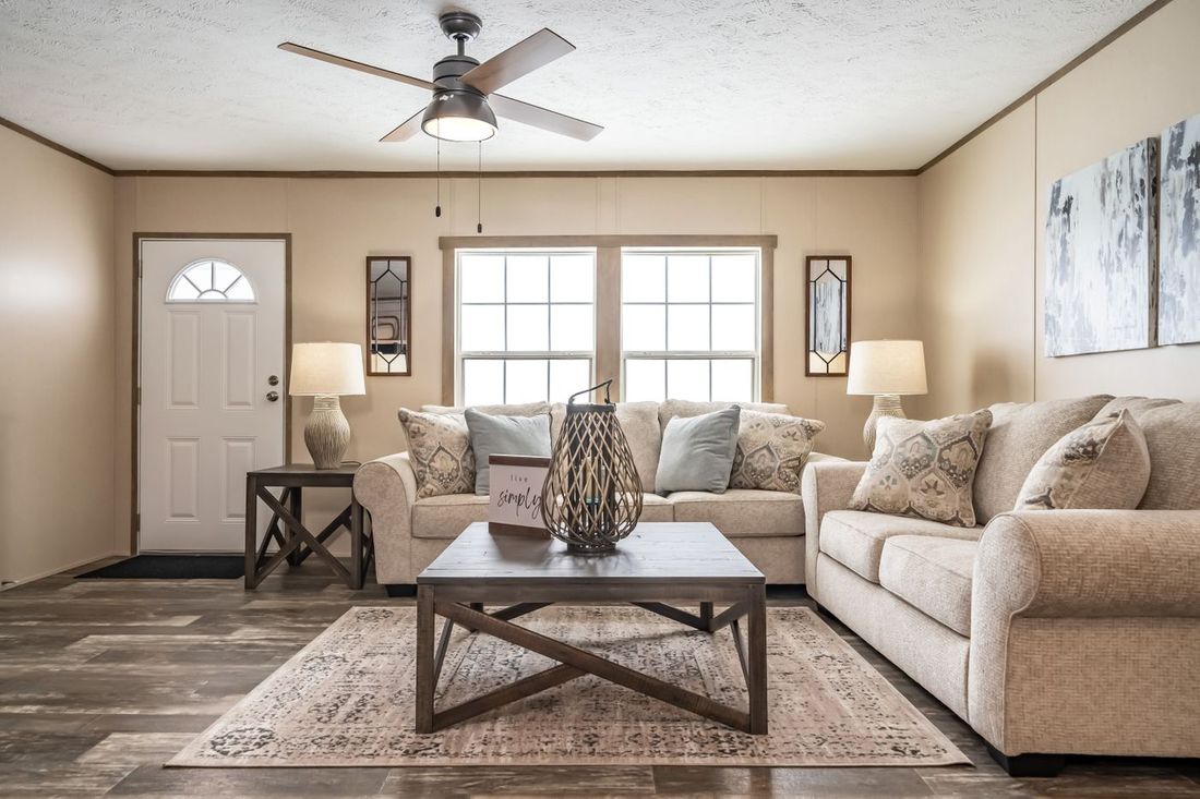 The ULTRA EXCEL 3 BR 28X56 Living Room. This Manufactured Mobile Home features 3 bedrooms and 2 baths.