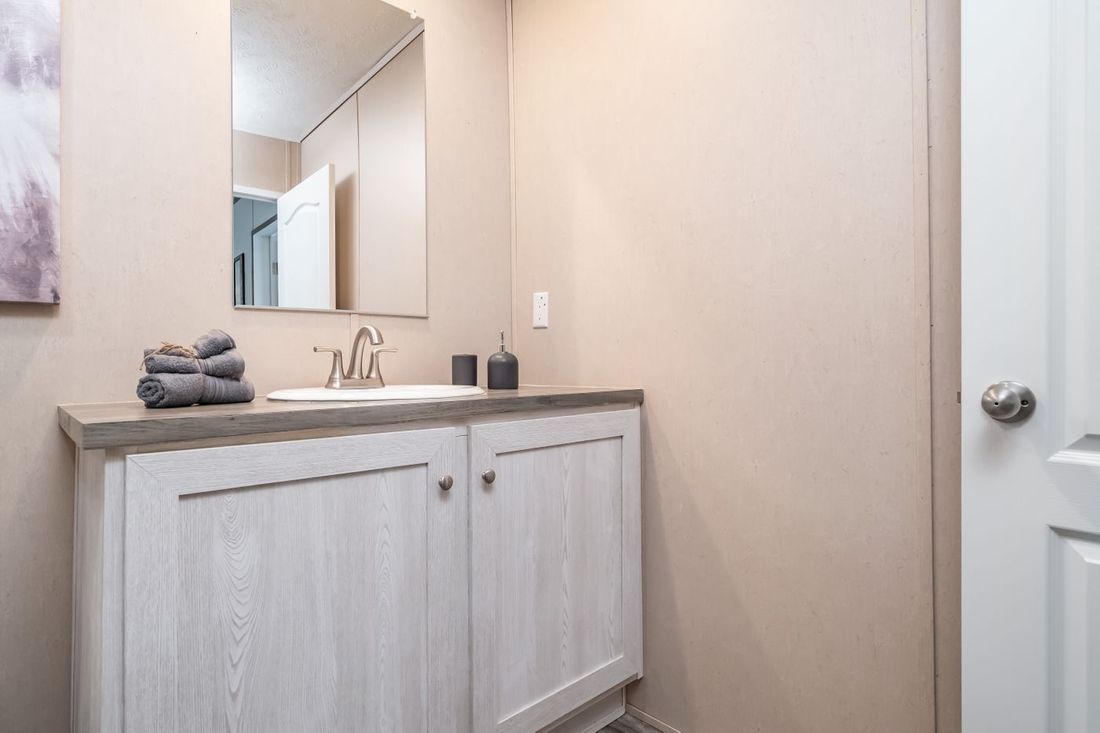 The ULTRA EXCEL 3 BR 28X56 Guest Bathroom. This Manufactured Mobile Home features 3 bedrooms and 2 baths.
