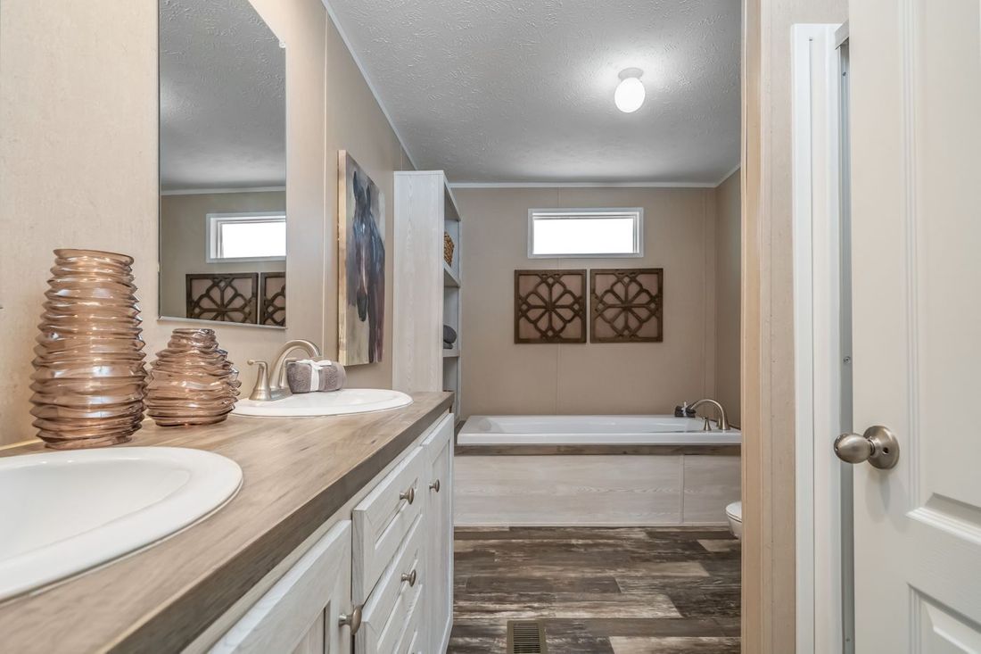 The ULTRA EXCEL 3 BR 28X56 Primary Bathroom. This Manufactured Mobile Home features 3 bedrooms and 2 baths.