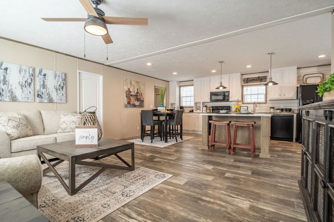 The ULTRA EXCEL 3 BR 28X56 Living Room. This Manufactured Mobile Home features 3 bedrooms and 2 baths.