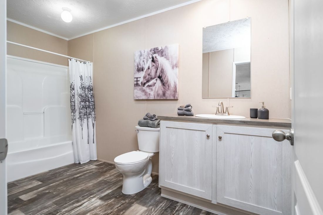 The ULTRA EXCEL 3 BR 28X56 Guest Bathroom. This Manufactured Mobile Home features 3 bedrooms and 2 baths.