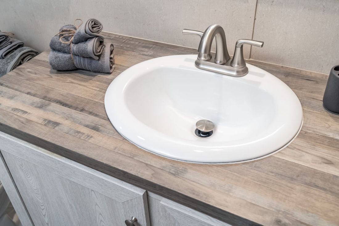 The ULTRA EXCEL 3 BR 28X56 Guest Bathroom. This Manufactured Mobile Home features 3 bedrooms and 2 baths.