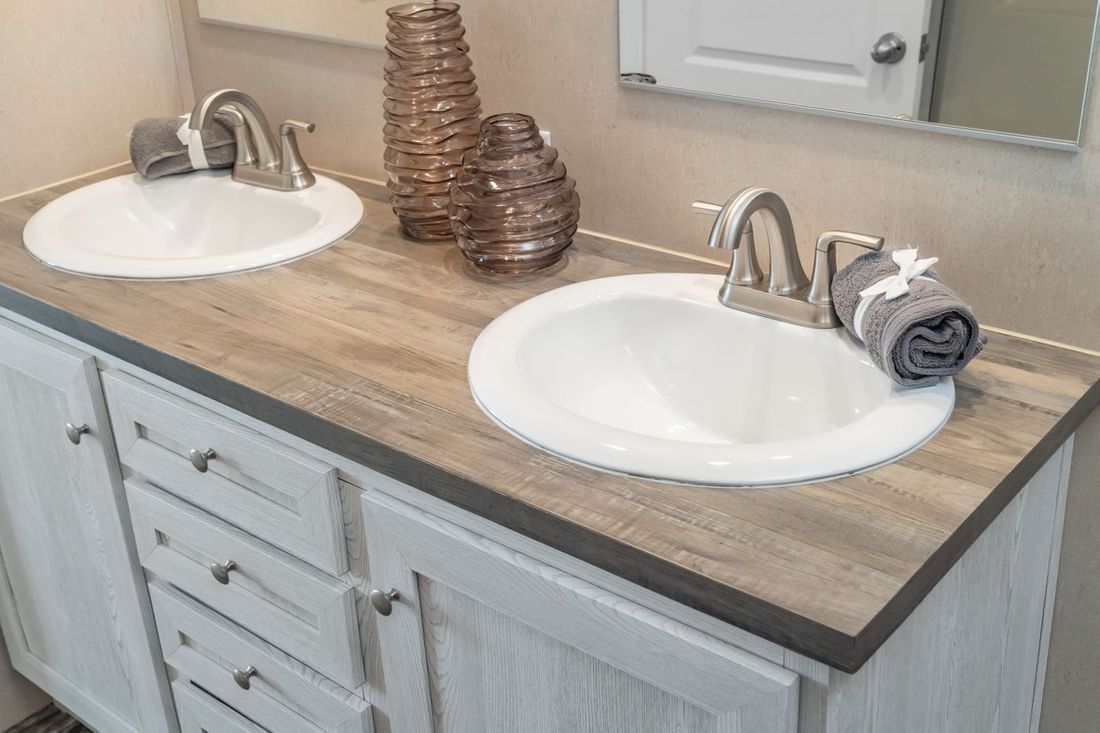 The ULTRA EXCEL 3 BR 28X56 Primary Bathroom. This Manufactured Mobile Home features 3 bedrooms and 2 baths.