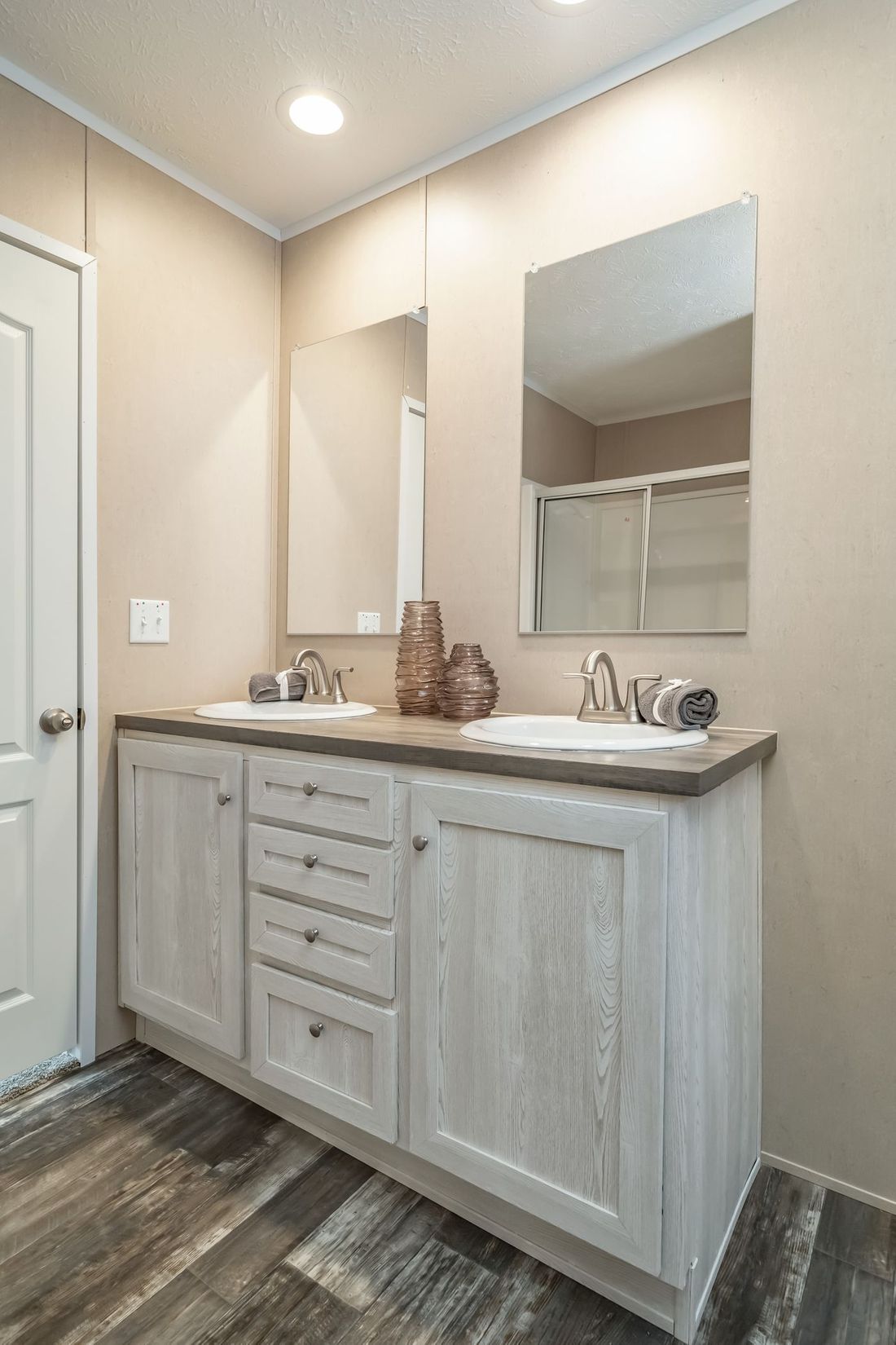 The ULTRA EXCEL 4 BR 28X56 Primary Bathroom. This Manufactured Mobile Home features 4 bedrooms and 2 baths.